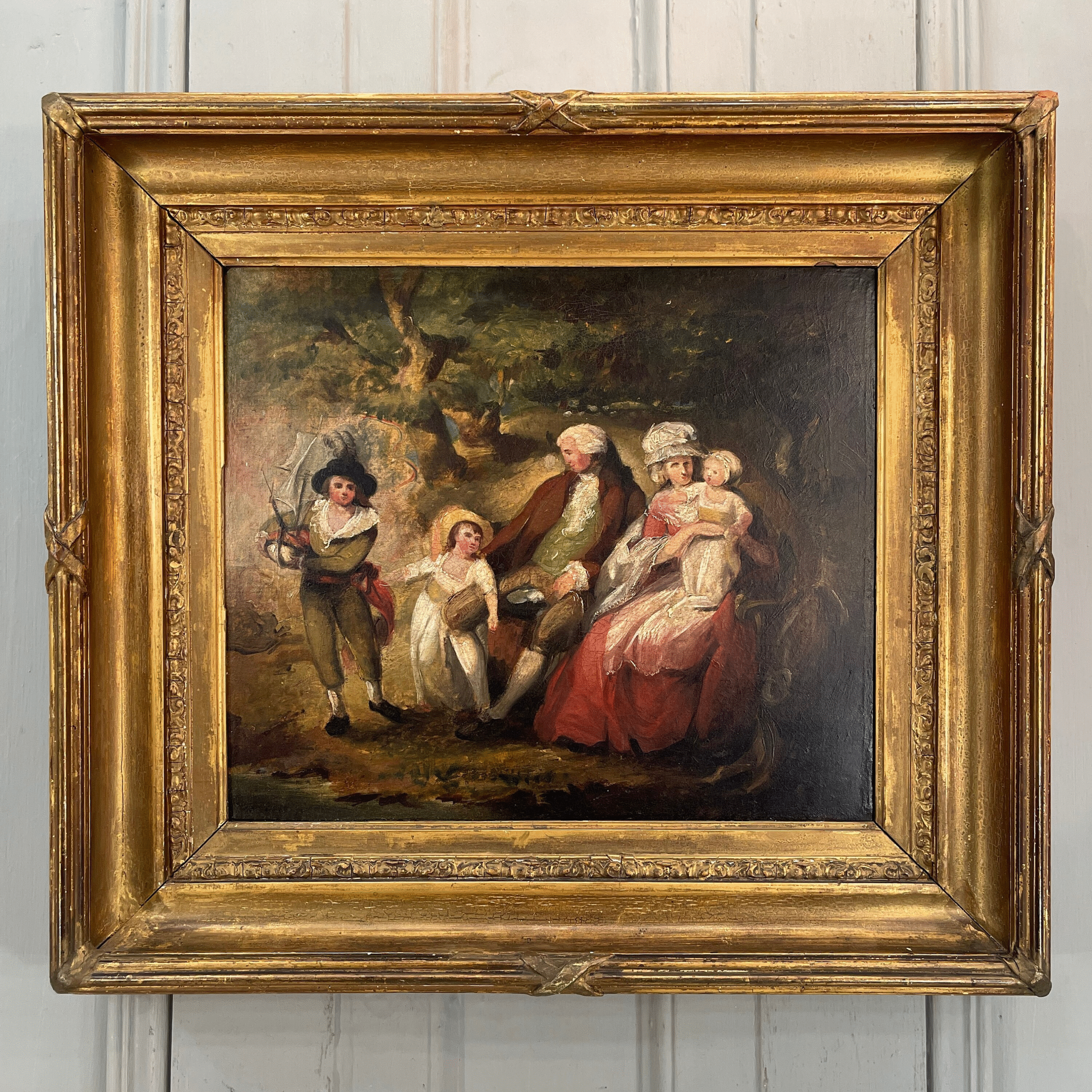 18th century oil painting of a family in a pastoral scene